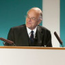 A speaker standing in front of a lecture.